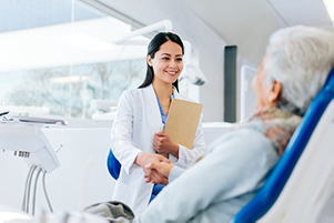 Dentist shaking patient's hand at Robert F. Walker Jr. DDS in Chandler, AZ