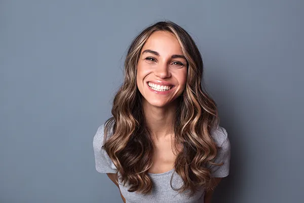 Joyful woman showing off her beautiful teeth with a smile