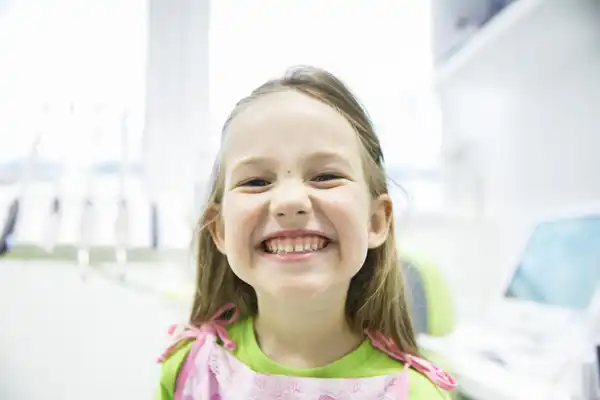 Little girl smiling at the dentist